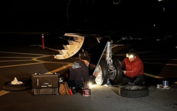 Topgun Maintenance working on an aircraft at night